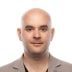attractive-bald-man-in-a-beige-jacket-on-a-white-b-2023-11-27-04-49-12-utc-1-qqbyrb5u4ezzl1o6hm6lhl259nw1f69k6cs9hg1l1s